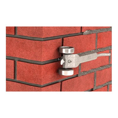 Skatewheel mortar raker with large wheels and adjustable depth for masonry joint removal in use 