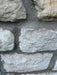 Close-up of a stone wall with gray stones