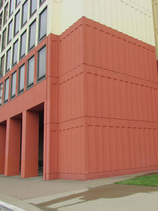 Red building corner with a modern architectural design