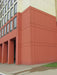 Red building corner with a modern architectural design
