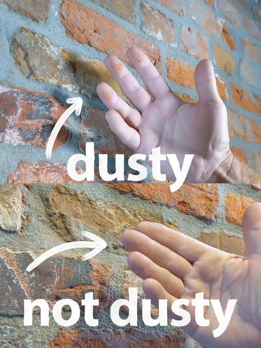Hand comparison showing 'dusty' and 'not dusty' on a textured wall background