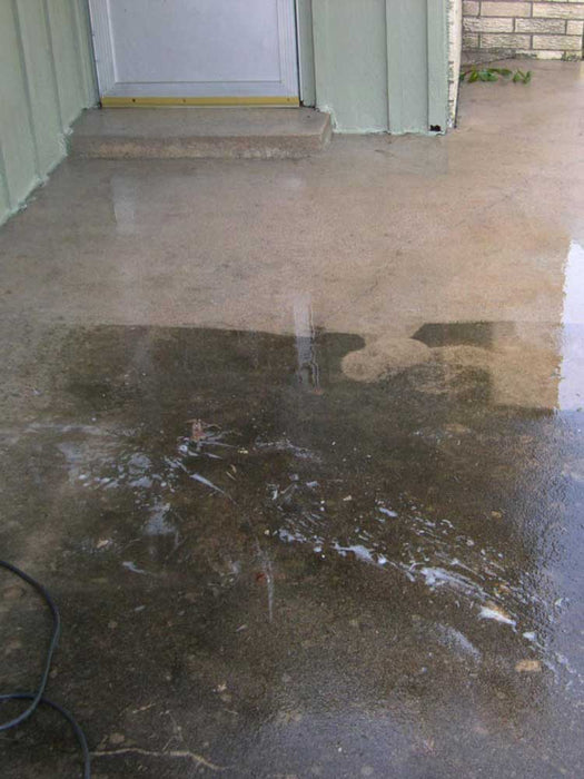Cleaner Degreaser applied to concrete floor removing oil stains and preparing surface for coating