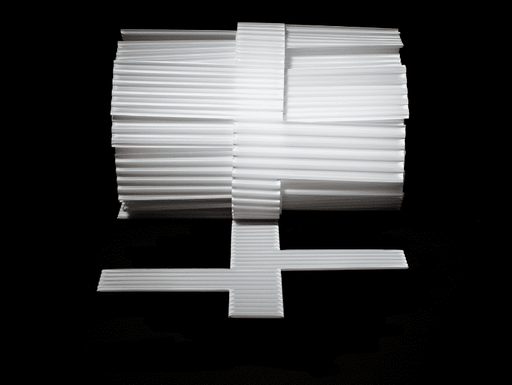 A white plastic Core Cavity Weep for CMU veneers, displayed on a dark background, with a cross-sectional view showing the drainage design.