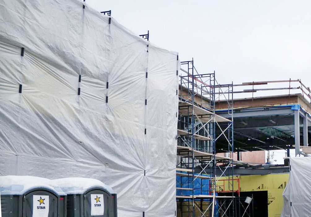 Scaffold wind clips for construction scaffolds, ensuring secure attachment of screens and protective sheeting