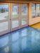 Polished concrete floor with glass doors leading outside
