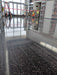 Integral color mixed into concrete overlay creating uniform colored polished concrete surface