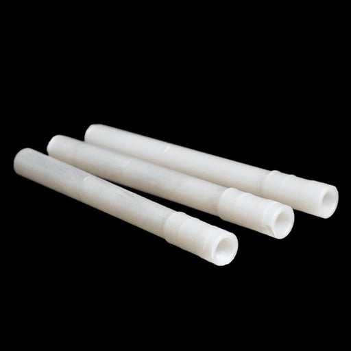 A set of white, cylindrical retrofit weep vents for brick walls.
