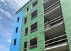 Building under construction with Z-Flex insulation on a blue sky background