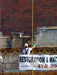 Person working on a building with a 'Restoration & Wat' banner in the foreground.