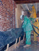 Workers in protective suits applying insulation to a wall.