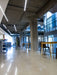 Modern indoor space with concrete pillars and tables