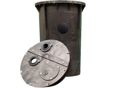 A black, cylindrical sump basket with a lid and multiple mechanical fasteners, designed for use in plumbing and waterproofing applications.