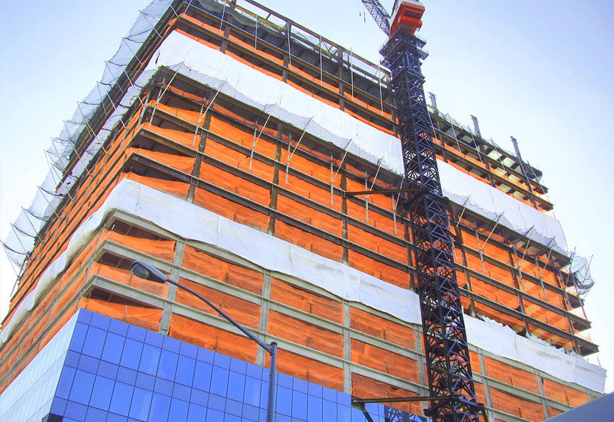 Construction safety netting designed to contain debris and protect workers and pedestrians