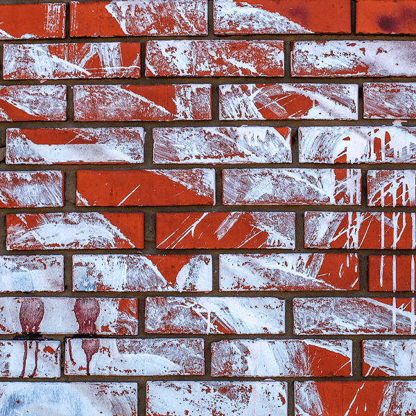 Patterned brick wall with red and white bricks