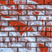Patterned brick wall with red and white bricks
