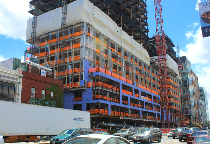 Heavy duty safety debris netting attached to scaffolding for job site protection