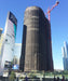 Knitted polyethylene mesh debris tarp designed for construction debris containment and wind protection