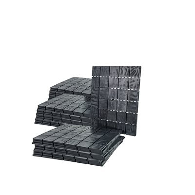 Stacks of black masonry shims on a white background