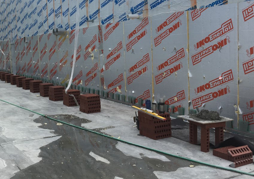 Masonry mortar net with integrated insect barrier, durable solution for commercial and residential wall construction
