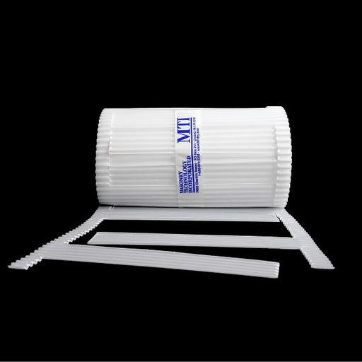 A roll of MTI Stone Cavity Weep, a white self-spaced weep for natural stone, with additional accessories lying beside it.