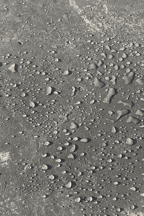 Close-up of textured gray surface with small stones