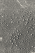 Close-up of textured gray surface with small stones